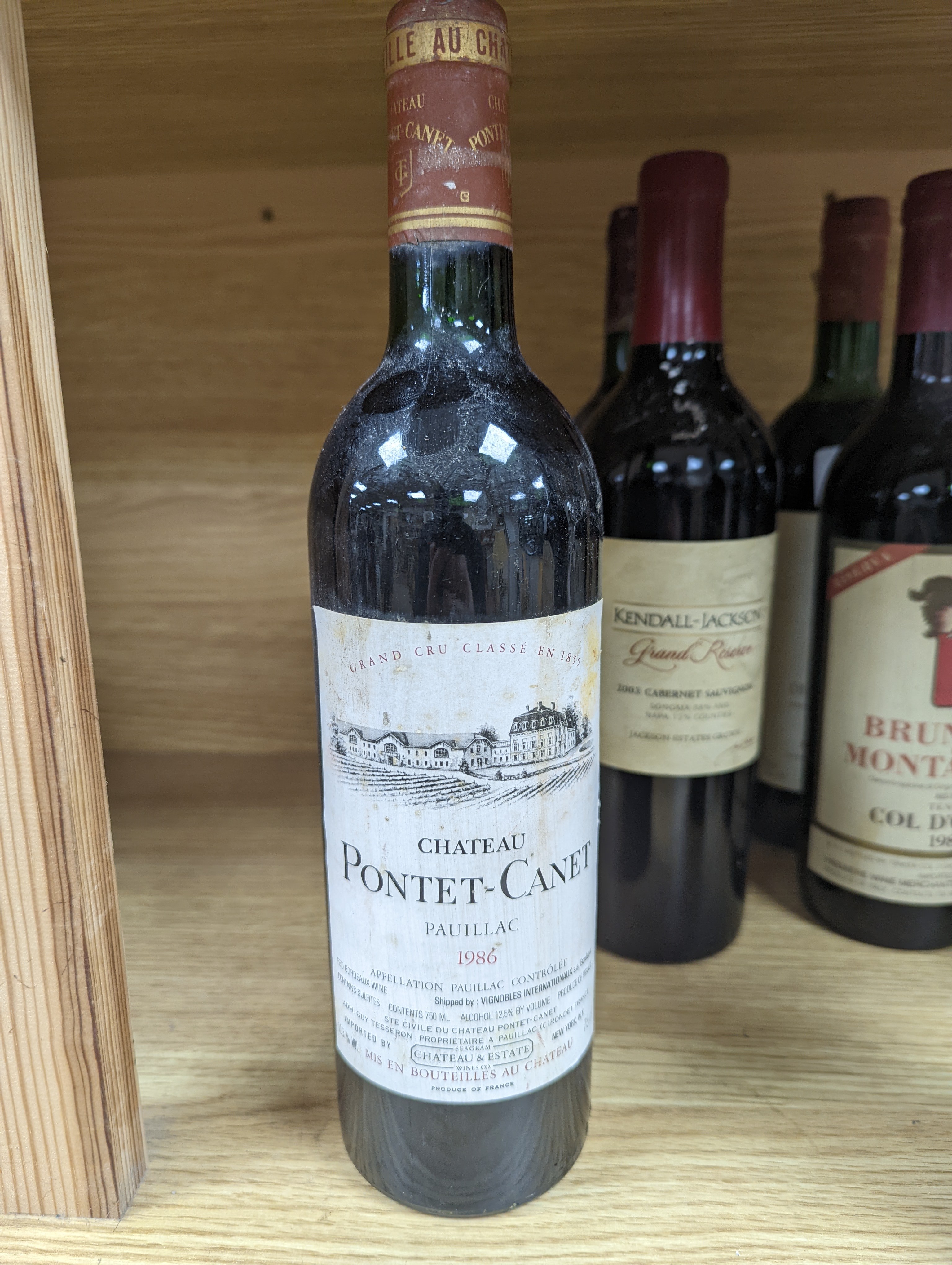 Twelve assorted bottles of wine including one Opus One, 1988, one Vosne Romanee, Jean Paul Selles, 1992, one Chateau Cazauviel, Margaux 1993, Chateau Pontet-Canet, 1986 and Brunello Montalcino, 1985 & 1991 etc.
